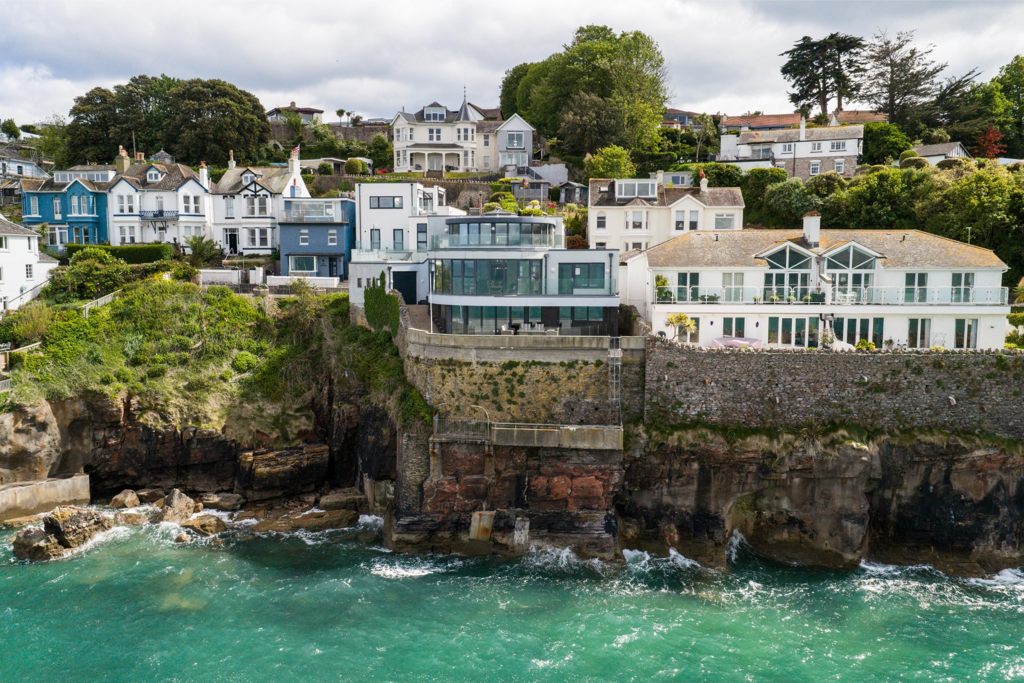 Waypoint’s contemporary sea-facing exterior above the Brixham shoreline